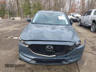 2021 Mazda CX-5 Touring with VIN JM3KFBCM5M0332644, listed as a IAAI auction lot 41083205 with 36,105 mi miles. Bid and sale history available at carsss.com. Image 12.