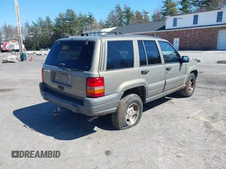 1997 Jeep Grand Cherokee Laredo with VIN 1J4GZ58S7VC713517, listed as a IAAI auction lot 42062214 with 205,533 mi miles. Bid and sale history available at carsss.com. Image 4.