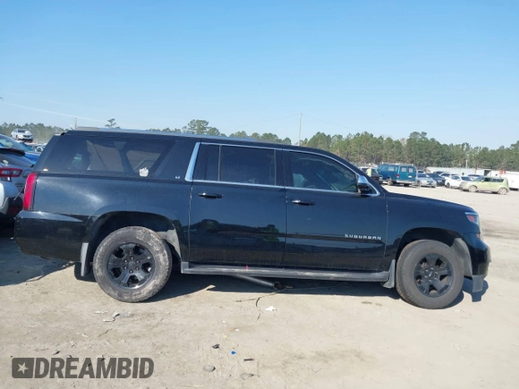 2018 Chevrolet Suburban LT with VIN 1GNSKHKCXJR268938, listed as a IAAI auction lot 41672886 with 76,844 mi miles and . Bid and sale history available at DreamBid. Image 13.
