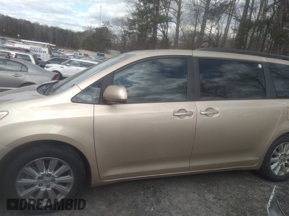 2011 Toyota Sienna XLE with VIN 5TDDK3DC3BS029476, listed as a IAAI auction lot 41393568 with 124,328 mi miles. Bid and sale history available at carsss.com. Image 14.