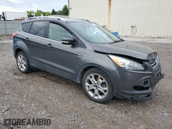 2015 Ford Escape Titanium with VIN 1FMCU9J96FUB32972, listed as a Copart auction lot 62886145 with 215,769 mi miles and Salvage title. Bid and sale history available at DreamBid. Image 4.