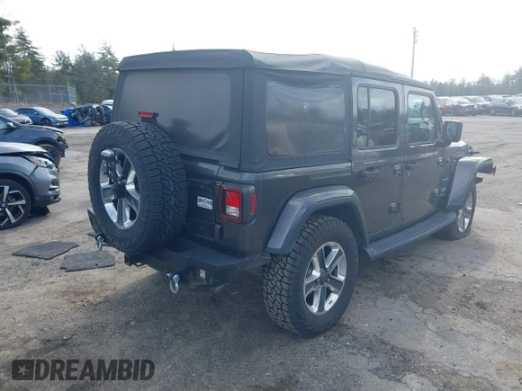2018 Jeep Wrangler Unlimited Sahara with VIN 1C4HJXEG0JW246110, listed as a IAAI auction lot 41826662 with 65,236 mi miles. Bid and sale history available at carsss.com. Image 4.