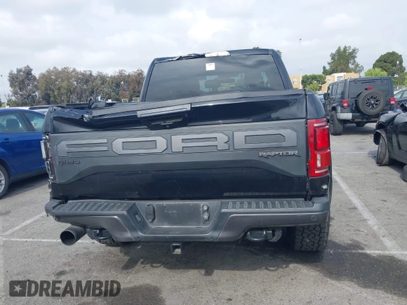 2020 Ford F-150 Raptor with VIN 1FTFW1RG2LFA30858, listed as a IAAI auction lot 42192391 with 90,018 mi miles and . Bid and sale history available at carsss.com. Image 16.