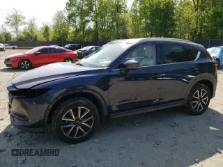 2018 Mazda CX-5 Grand Touring with VIN JM3KFBDM9J1364856, listed as a Copart auction lot 54944365 with 105,168 mi miles and Salvage title. Bid and sale history available at DreamBid. Image 1.