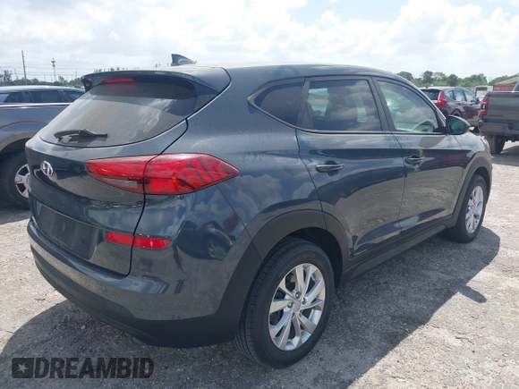 2021 Hyundai Tucson SE with VIN KM8J23A41MU291085, listed as a IAAI auction lot 41956974 with 93,932 mi miles. Bid and sale history available at carsss.com. Image 4.