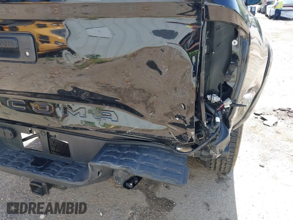 2023 Toyota Tacoma SR with VIN 3TMCZ5AN1PM654572, listed as a IAAI auction lot 42312575 with 14,111 mi miles and . Bid and sale history available at DreamBid. Image 6.