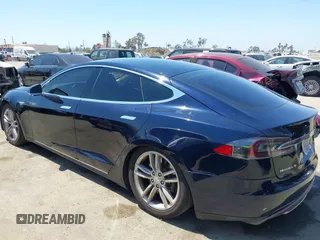 2013 Tesla Model S with VIN 5YJSA1DN1DFP05317, listed as a IAAI auction lot 42086998 with 150,964 mi miles. Bid and sale history available at carsss.com. Image 3.