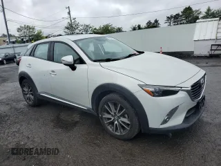 2016 Mazda CX-3 Grand Touring z VIN JM1DKBD77G0105451, wystawiony jako Copart lot #58341495 z przebiegiem 109 525 mil mil oraz Szkody całkowita. Historia ofert i sprzedaży dostępna na DreamBid. Obrazek 4.