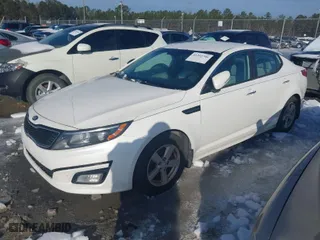 2015 Kia Optima LX with VIN KNAGM4A71F5580809, listed as a IAAI auction lot 41393706 with 106,389 mi miles. Bid and sale history available at carsss.com. Image 2.