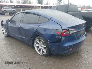 2022 Tesla Model 3 Long Range with VIN 5YJ3E1EB1NF142574, listed as a IAAI auction lot 41213900 with 127,404 mi miles and . Bid and sale history available at DreamBid. Image 3.