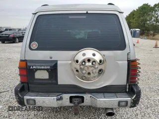 1995 Mitsubishi Montero z VIN JA4MR41H7SJ024208, wystawiony jako Copart lot #42971825 z przebiegiem 313 990 mil mil oraz Szkoda całkowita • Salvage title. Historia ofert i sprzedaży dostępna na DreamBid. Obrazek 6.