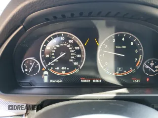 2014 BMW X5 xDrive50i with VIN 5UXKR6C54E0J72983, listed as a Copart auction lot 51047625 with 100,692 mi miles and Salvage Title. Bid and sale history available at carsss.com. Image 9.