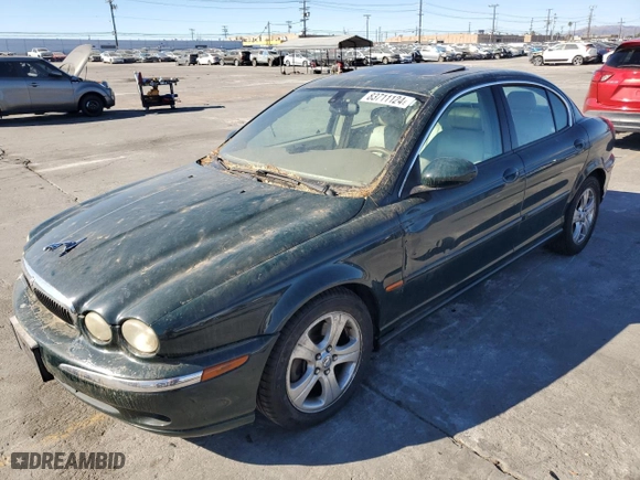 2002 Jaguar X-Type with VIN SAJEA51C12WC33477, listed as a Copart auction lot 83711124 with 165,637 mi miles and Salvage Title. Bid and sale history available at carsss.com. Image 1.