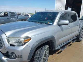 2018 Toyota Tacoma SR with VIN 3TMCZ5AN3JM170037, listed as a IAAI auction lot 42565385 with 157,450 mi miles and . Bid and sale history available at DreamBid. Image 6.