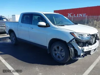 2020 Honda Ridgeline RTL-E with VIN 5FPYK3F76LB005008, listed as a IAAI auction lot 41662580 with 33,987 mi miles. Bid and sale history available at carsss.com. Image 1.