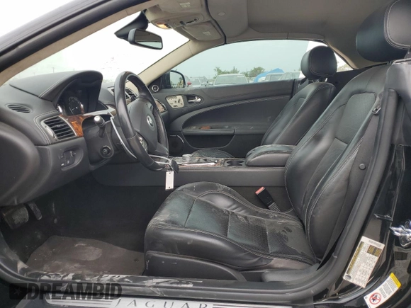 2010 Jaguar XK with VIN SAJWA4GBXALB36341, listed as a Copart auction lot 68307584 with 76,951 mi miles and Salvage Title. Bid and sale history available at carsss.com. Image 7.