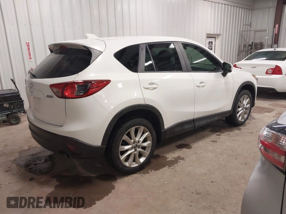 2014 Mazda CX-5 Grand Touring with VIN JM3KE4DY3E0374036, listed as a IAAI auction lot 41889030 with 162,611 mi miles and . Bid and sale history available at DreamBid. Image 4.