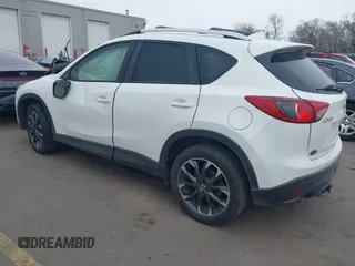 2016 Mazda CX-5 Grand Touring z VIN JM3KE2DY8G0885006, wystawiony jako IAAI lot #41615873 z przebiegiem 118 890 mil mil oraz . Historia ofert i sprzedaży dostępna na DreamBid. Obrazek 3.