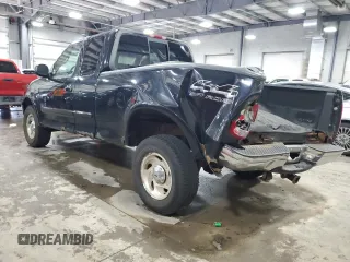 2000 Ford F-150 XL with VIN 1FTRX18L7YNA85909, listed as a Copart auction lot 56056165 with 134,765 mi miles and Salvage title. Bid and sale history available at DreamBid. Image 2.