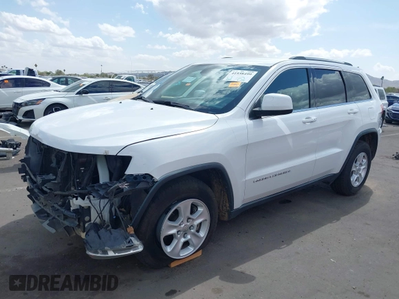 2014 Jeep Grand Cherokee Laredo with VIN 1C4RJEAG3EC125478, listed as a IAAI auction lot 41938499 with 167,588 mi miles and . Bid and sale history available at DreamBid. Image 2.