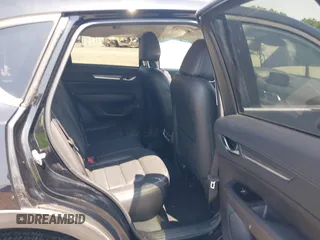 2020 Mazda CX-5 Grand Touring with VIN JM3KFADM9L1837183, listed as a IAAI auction lot 42340628 with 81,975 mi miles and . Bid and sale history available at DreamBid. Image 8.