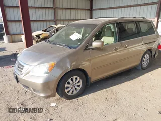 2010 Honda Odyssey EX-L with VIN 5FNRL3H79AB048049, listed as a IAAI auction lot 42055090 with 142,736 mi miles. Bid and sale history available at carsss.com. Image 2.