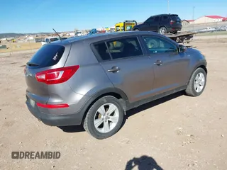 2012 Kia Sportage LX with VIN KNDPBCA27C7318056, listed as a IAAI auction lot 41887312 with 144,940 mi miles and . Bid and sale history available at DreamBid. Image 4.