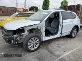 2018 Volkswagen Tiguan S with VIN 3VV1B7AXXJM013468, listed as a Copart auction lot 58371875 with 61,464 mi miles and Salvage title. Bid and sale history available at DreamBid. Image 1.