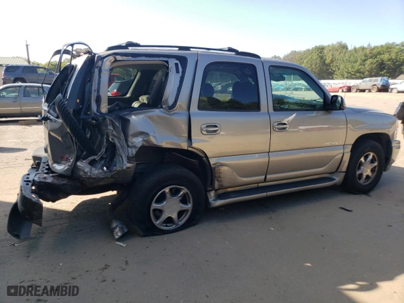 2002 GMC Yukon Denali with VIN 1GKEK63U72J274220, listed as a Copart auction lot 71891634 with 140,885 mi miles and Salvage Title. Bid and sale history available at carsss.com. Image 3.