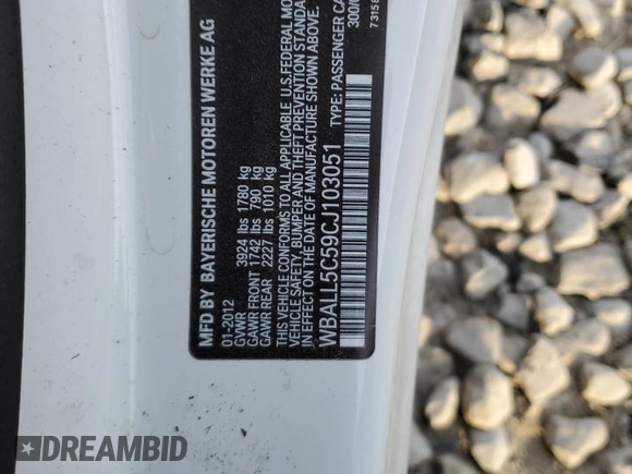 2012 BMW Z4 sDrive28i with VIN WBALL5C59CJ103051, listed as a Copart auction lot 87015834 with 92,071 mi miles and Salvage title. Bid and sale history available at DreamBid. Image 14.