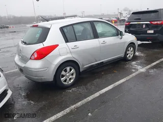 2009 Nissan Versa 1.8 SL with VIN 3N1BC13E59L420840, listed as a IAAI auction lot 41503232 with 129,824 mi miles. Bid and sale history available at carsss.com. Image 4.