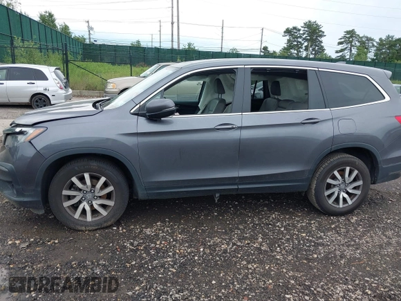 2019 Honda Pilot EX-L with VIN 5FNYF6H5XKB096065, listed as a IAAI auction lot 42631239 with 171,768 mi miles and . Bid and sale history available at DreamBid. Image 14.