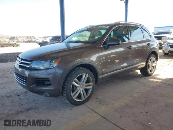2012 Volkswagen Touareg Exec with VIN WVGEF9BP8CD008665, listed as a Copart auction lot 84611354 with 103,090 mi miles and Salvage Title. Bid and sale history available at DreamBid. Image 1.