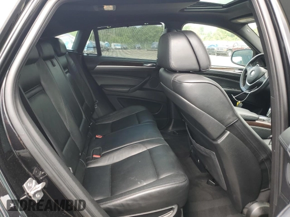 2012 BMW X6 50i z VIN 5UXFG8C51CLZ97393, wystawiony jako Copart lot #58407285 z przebiegiem 128 040 mil mil oraz Szkoda całkowita • Salvage title. Historia ofert i sprzedaży dostępna na DreamBid. Obrazek 11.