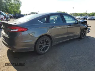 2018 Ford Fusion SE z VIN 3FA6P0LU9JR242443, wystawiony jako Copart lot #58049355 z przebiegiem 123 990 mil mil oraz Szkoda całkowita • Salvage title. Historia ofert i sprzedaży dostępna na DreamBid. Obrazek 3.
