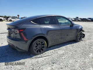2025 Tesla Model Y Long Range with VIN 7SAYGAEEXSF253326, listed as a Copart auction lot 49527965 with 5,803 mi miles and Salvage Title. Bid and sale history available at DreamBid. Image 3.