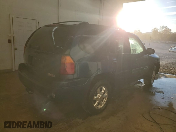 2005 GMC Envoy SLT with VIN 1GKDS13S652339845, listed as a Copart auction lot 77693684 with 220,306 mi miles and Salvage Title. Bid and sale history available at carsss.com. Image 3.
