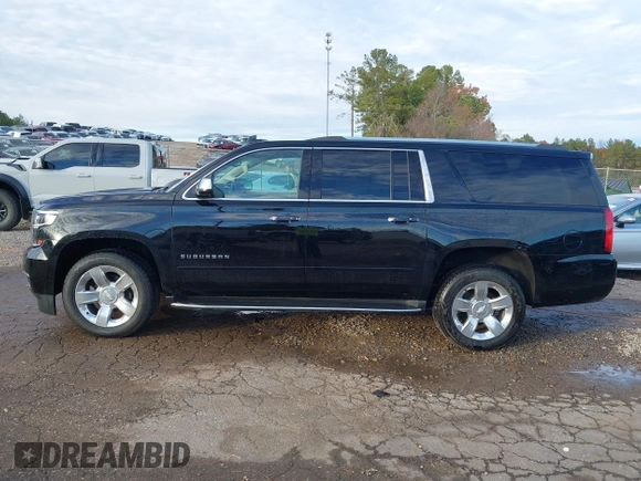 2020 Chevrolet Suburban Premier with VIN 1GNSCJKC0LR121728, listed as a IAAI auction lot 41105003 with 43,820 mi miles and . Bid and sale history available at DreamBid. Image 14.