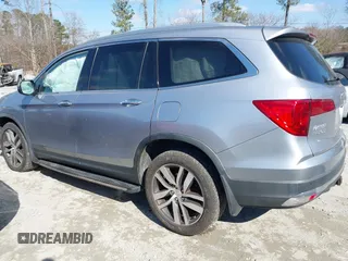 2017 Honda Pilot Touring with VIN 5FNYF6H94HB006873, listed as a IAAI auction lot 41618529 with 154,689 mi miles. Bid and sale history available at carsss.com. Image 3.