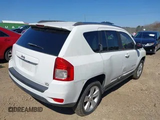 2012 Jeep Compass Sport with VIN 1C4NJCBA1CD660068, listed as a IAAI auction lot 41766146 with 173,445 mi miles. Bid and sale history available at carsss.com. Image 4.