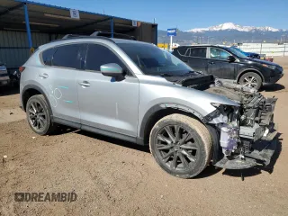 2019 Mazda CX-5 Grand Touring with VIN JM3KFADM6K0543888, listed as a Copart auction lot 56310785 with 112,737 mi miles and Salvage title. Bid and sale history available at DreamBid. Image 4.