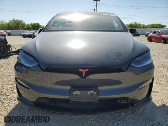 2023 Tesla Model X with VIN 7SAXCDE5XPF422163, listed as a Copart auction lot 52573185 with Not Provided miles and Salvage Title. Bid and sale history available at DreamBid. Image 5.