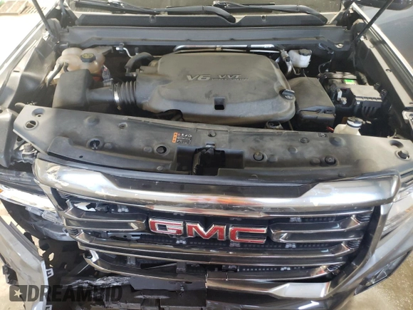 2021 GMC Canyon 4WD AT4 z VIN 1GTG6FEN1M1203936, wystawiony jako Copart lot #56041315 z przebiegiem 54 939 mil mil oraz Szkoda całkowita • Salvage title. Historia ofert i sprzedaży dostępna na DreamBid. Obrazek 11.