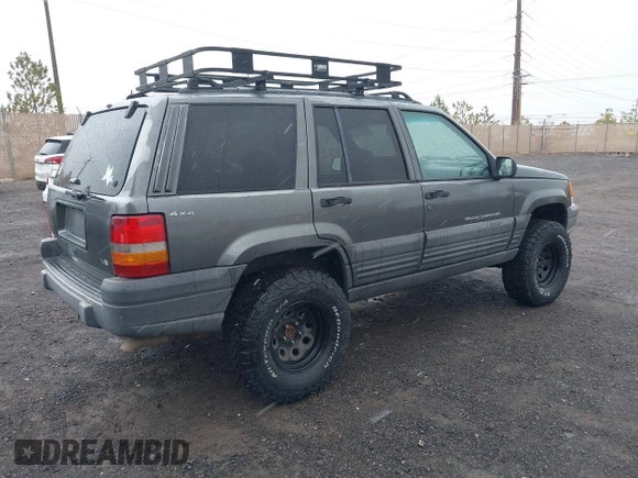1997 Jeep Grand Cherokee Laredo with VIN 1J4GZ58Y8VC624804, listed as a IAAI auction lot 41736324 with 165,851 mi miles. Bid and sale history available at carsss.com. Image 4.