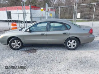 2002 Ford Taurus SE Standard with VIN 1FAFP53U72A145136, listed as a IAAI auction lot 41768868 with 209,765 mi miles and . Bid and sale history available at DreamBid. Image 14.