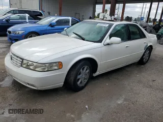 1999 Cadillac Seville Touring STS z VIN 1G6KY5491XU934701, wystawiony jako Copart lot #83812814 z przebiegiem Nie podano mil oraz Nie do naprawy. Historia ofert i sprzedaży dostępna na DreamBid. Obrazek 1.