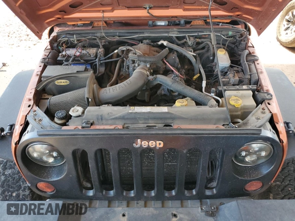 2011 Jeep Wrangler Unlimited Rubicon with VIN 1J4BA6H13BL538385, listed as a Copart auction lot 64080075 with 90,459 mi miles and Salvage title. Bid and sale history available at DreamBid. Image 12.