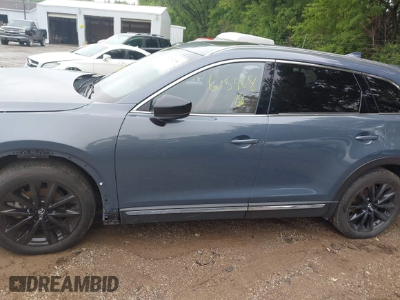 2022 Mazda CX-9 Grand Touring with VIN JM3TCBDY0N0615968, listed as a IAAI auction lot 42312159 with 22,912 mi miles and . Bid and sale history available at DreamBid. Image 14.