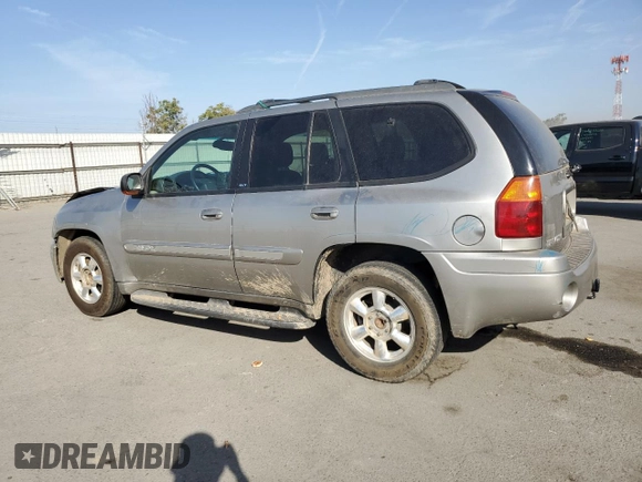 2003 GMC Envoy SLE with VIN 1GKDS13S332390989, listed as a Copart auction lot 74729104 with 127,680 mi miles and Salvage Title. Bid and sale history available at DreamBid. Image 2.