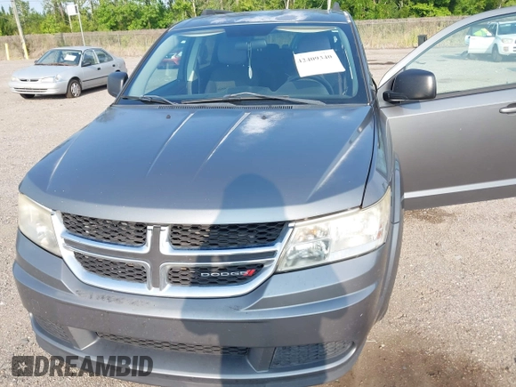 2013 Dodge Journey SE z VIN 3C4PDCAB5DT518019, wystawiony jako IAAI lot #42409340 z przebiegiem 174 339 mil mil oraz . Historia ofert i sprzedaży dostępna na DreamBid. Obrazek 6.